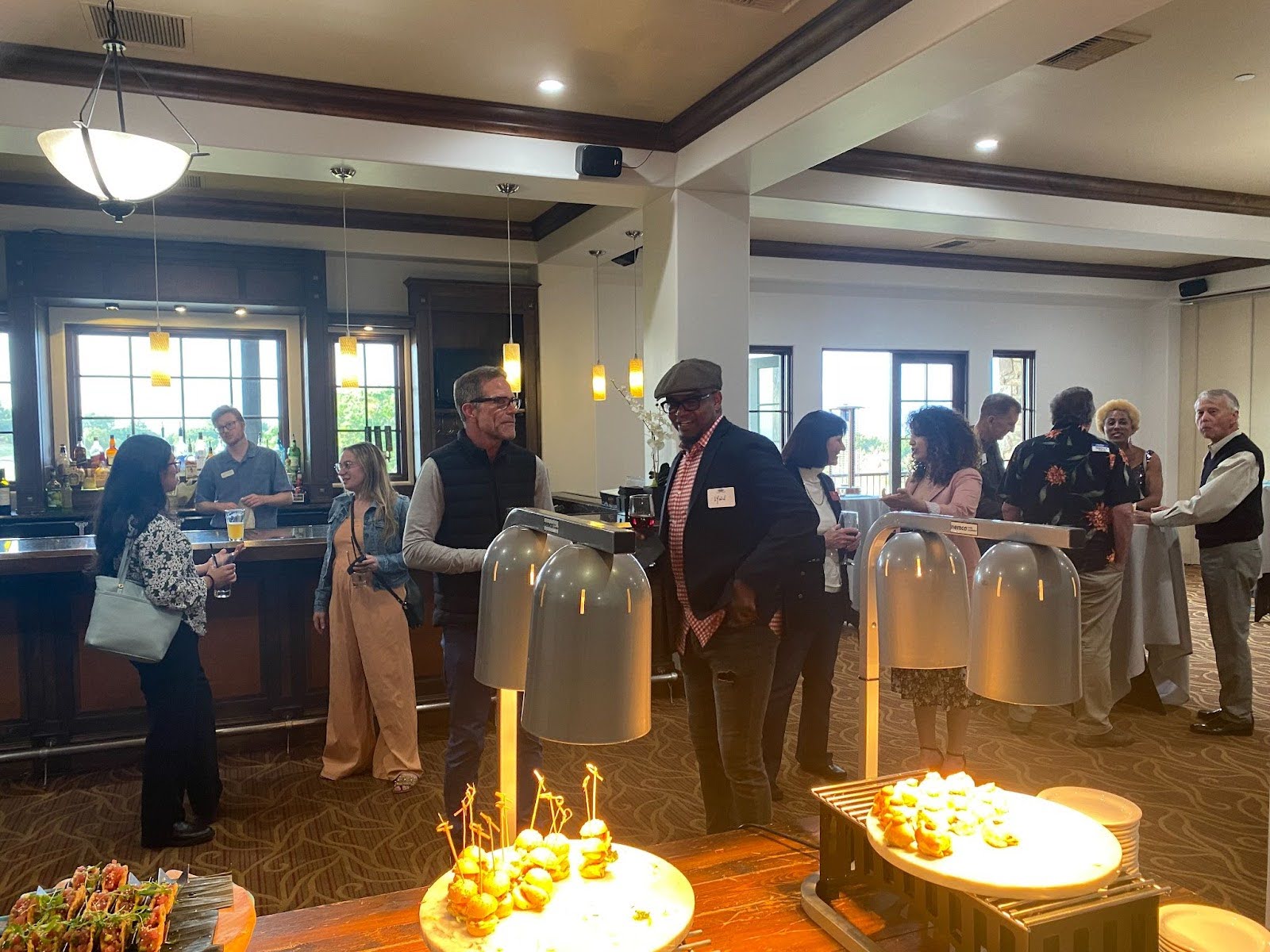 Aliso Viejo Chamber members enjoying good conversation and food at the Aliso Viejo Country Club after hours mixer event.